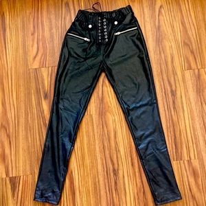 Black faux leather pants with lace up